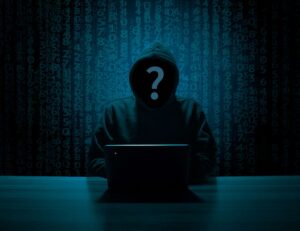 Hooded hacker representing AI-powered cyberattacks